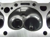 “UnderCover Ported” RHS Vortec Head The Vortec style chamber is superior to standard Chevy